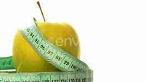 تیزر برای لاغری لایه باز Green, Fresh Apple with Measuring Tape on White