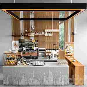 طراحی کافی شاپ با چوب و بتن پذیرش JC Coffee Shop 7