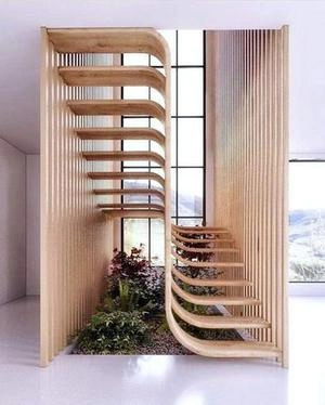 پله های منحنی وار ترکیب چوب و شیشه
